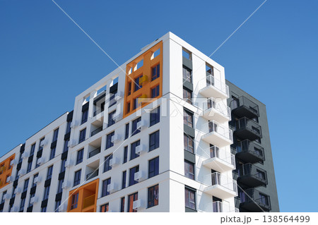 Skyscraper. New building. Orange and white skyscraper. Real estate agent. House for sale sign. Skyscraper. New building. Orange and white skyscraper. Real estate agent. House for sale sign. 138564499
