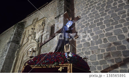 Procession statue of jesus carrying a cross at night during semana santa in spain for religious parade background and banner design Procession statue of jesus carrying a cross at night during semana santa in spain for religious parade background and banner design 138565891