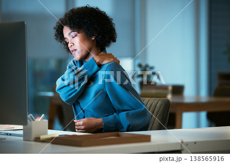 Back pain, night and business woman tired of overtime, deadline and work pressure with burnout and muscle strain. Corporate, evening and employee with stress injury working late in a company Back pain, night and business woman tired of overtime, deadline and work pressure with burnout and muscle strain. Corporate, evening and employee with stress injury working late in a company 138565916
