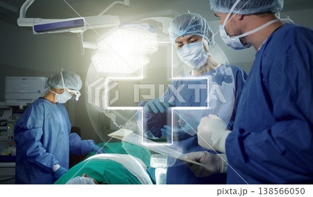 Hologram, teamwork and doctors in a hospital for surgery together, working in theater to save a life. World healthcare, medical and a surgeon team in the operating room of a clinic for an operation Hologram, teamwork and doctors in a hospital for surgery together, working in theater to save a life. World healthcare, medical and a surgeon team in the operating room of a clinic for an operation 138566050