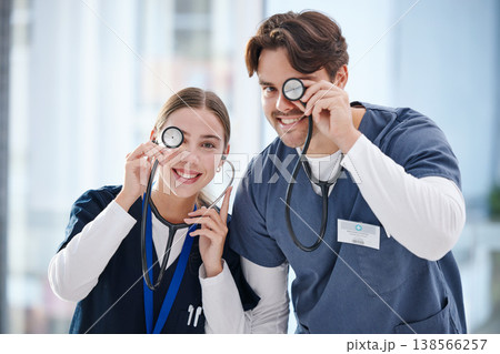 Portrait, healthcare and stethoscope with nurse friends having fun in the hospital together for cardiology. Smile, funny or comedy with a man and woman medicine professional in a medical clinic Portrait, healthcare and stethoscope with nurse friends having fun in the hospital together for cardiology. Smile, funny or comedy with a man and woman medicine professional in a medical clinic 138566257