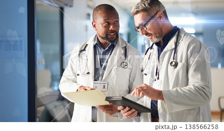 Teamwork, tablet or senior doctors talking for advice in healthcare discussion for file documents. Mature surgeon, leadership or men speaking of collaboration for medical research in hospital clinic Teamwork, tablet or senior doctors talking for advice in healthcare discussion for file documents. Mature surgeon, leadership or men speaking of collaboration for medical research in hospital clinic 138566258