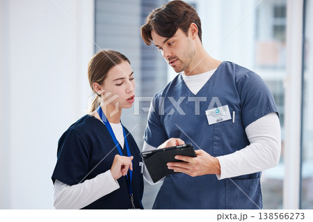 Healthcare, doctor and nurse with tablet, discussion and schedule at hospital with teamwork. Medical professional, man and woman with digital app for telehealth, health insurance website and advice. Healthcare, doctor and nurse with tablet, discussion and schedule at hospital with teamwork. Medical professional, man and woman with digital app for telehealth, health insurance website and advice. 138566273