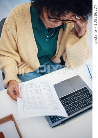 Woman, laptop and documents in debt, financial crisis or mistake with expenses, bills or invoice at home. Female person or freelancer with paperwork on computer in finance struggle or bankruptcy Woman, laptop and documents in debt, financial crisis or mistake with expenses, bills or invoice at home. Female person or freelancer with paperwork on computer in finance struggle or bankruptcy 138566377