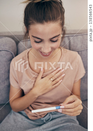 Pregnancy test, smile and woman on sofa in home, reading good news and check positive results. Pregnant, stick and happy mother in living room excited for success, future maternity and ivf fertility Pregnancy test, smile and woman on sofa in home, reading good news and check positive results. Pregnant, stick and happy mother in living room excited for success, future maternity and ivf fertility 138566543