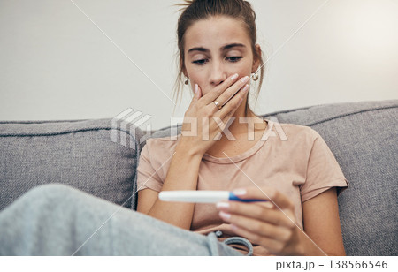 Pregnancy test, surprise and woman on sofa in home, reading bad news and check negative results. Pregnant, stick and sad mother in living room shocked for maternity, stress and anxiety for fertility Pregnancy test, surprise and woman on sofa in home, reading bad news and check negative results. Pregnant, stick and sad mother in living room shocked for maternity, stress and anxiety for fertility 138566546