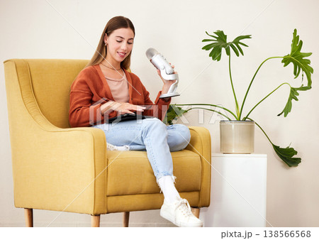 Microphone, production and woman on a chair for podcast on mobile app, social media or the internet. Radio, broadcast and young female presenter hosting a journalism platform in recording space. Microphone, production and woman on a chair for podcast on mobile app, social media or the internet. Radio, broadcast and young female presenter hosting a journalism platform in recording space. 138566568