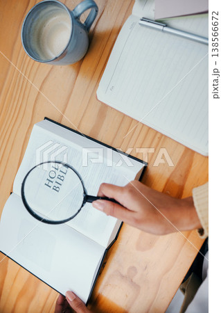 Bible, research and hands of person with magnifying glass to study religion, holy spirit and the gospel of God to worship. Information, spiritual and closeup of Christian learning faith and prayer Bible, research and hands of person with magnifying glass to study religion, holy spirit and the gospel of God to worship. Information, spiritual and closeup of Christian learning faith and prayer 138566672
