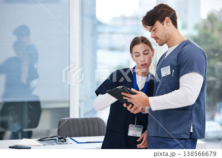 Doctors, man and woman with tablet in office at hospital with research, healthcare and teamwork. Medical professional, nurse and surgeon with digital app for telehealth, insurance website and advice. Doctors, man and woman with tablet in office at hospital with research, healthcare and teamwork. Medical professional, nurse and surgeon with digital app for telehealth, insurance website and advice. 138566679