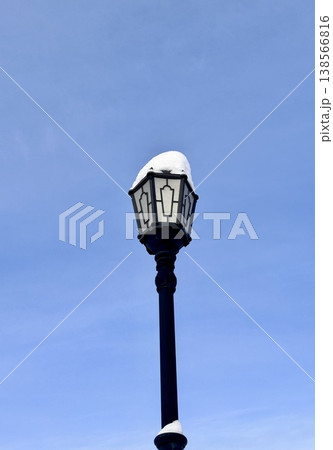 city street lamp on the background of the blue sky in winter 138566816