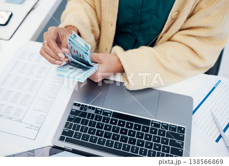 Hands, laptop and a business person counting money closeup in the office of a bank for accounting. Cash, budget and trading with a financial advisor in the workplace for investment growth from above Hands, laptop and a business person counting money closeup in the office of a bank for accounting. Cash, budget and trading with a financial advisor in the workplace for investment growth from above 138566869
