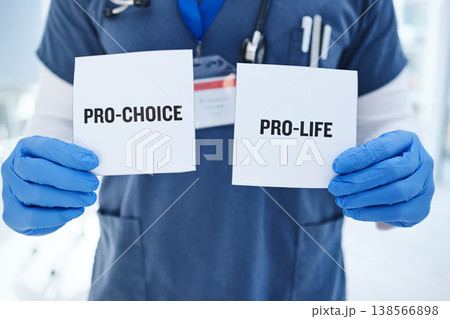 Life, choice and doctor with paper in hands for abortion, human rights or decision in clinic. Nurse, poster and vote for women with option for family planning in hospital or medical contraception Life, choice and doctor with paper in hands for abortion, human rights or decision in clinic. Nurse, poster and vote for women with option for family planning in hospital or medical contraception 138566898