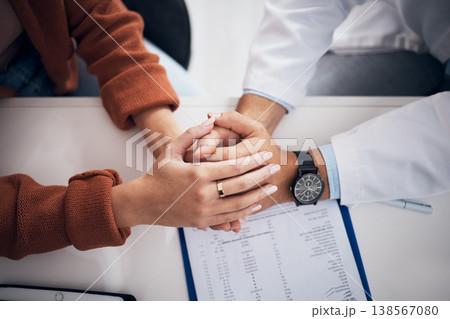 Diagnosis, results and doctor holding hands with patient for support, care and kindness in clinic or hospital. Healthcare, empathy and counseling person with medical, report and announcement of news 138567080