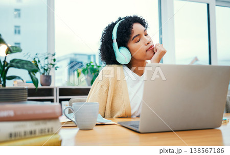 Music, headphones and meditation of business woman on laptop in startup office. Radio, relax and professional at desk listening to sound, audio and streaming podcast online for peace, calm and zen 138567186