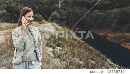 Phone call, hiking and happy woman in nature, talking or listening to communication for connection. Mobile, smile and person in conversation in woods, trekking and travel on holiday outdoor in forest Phone call, hiking and happy woman in nature, talking or listening to communication for connection. Mobile, smile and person in conversation in woods, trekking and travel on holiday outdoor in forest 138567194