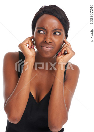 Woman, ears and studio annoyed or noise listening, tired or frustrated frown. Black model person, confused face and white background for mental health bad mood or anxiety, angry pain for thinking Woman, ears and studio annoyed or noise listening, tired or frustrated frown. Black model person, confused face and white background for mental health bad mood or anxiety, angry pain for thinking 138567246