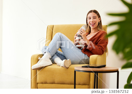 Microphone, production and happy woman hosting podcast on a chair by a wall in her modern home. Radio, broadcast and young female person hosting a journalism talk show in a recording space at house. Microphone, production and happy woman hosting podcast on a chair by a wall in her modern home. Radio, broadcast and young female person hosting a journalism talk show in a recording space at house. 138567252