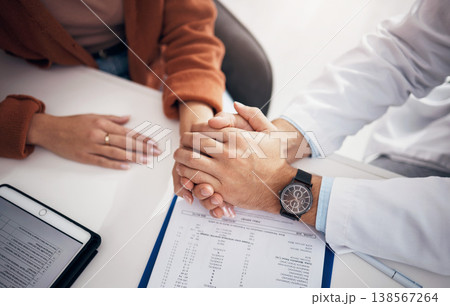 Diagnosis, results and doctor holding hands with patient for support, care and kindness in clinic or hospital. Healthcare, empathy and counseling person with medical, report and announcement of news 138567264