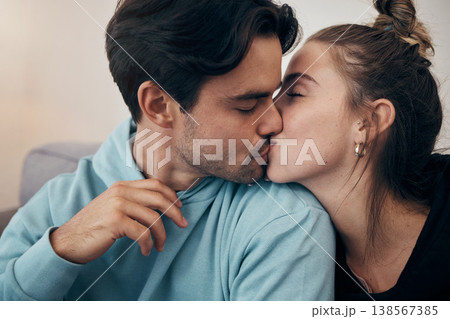Couple, relax and kiss on sofa with love in home, living room or house with happy, partnership or marriage. Romantic, people and bonding with man and woman in affection for support and care together Couple, relax and kiss on sofa with love in home, living room or house with happy, partnership or marriage. Romantic, people and bonding with man and woman in affection for support and care together 138567385