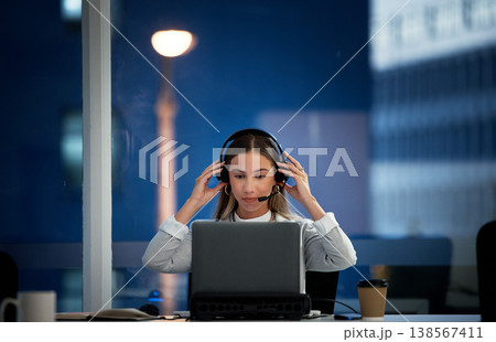 Business woman, call center and headphones at night for communication, ready for telemarketing and sales in office. Professional agent, consultant or worker start job, telecom or ecommerce on laptop Business woman, call center and headphones at night for communication, ready for telemarketing and sales in office. Professional agent, consultant or worker start job, telecom or ecommerce on laptop 138567411