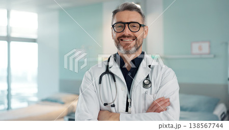 Healthcare, doctor and man with arms crossed at hospital with smile for support, service and wellness. Medicine, professional and expert with glasses and pride for career, surgery, insurance and care Healthcare, doctor and man with arms crossed at hospital with smile for support, service and wellness. Medicine, professional and expert with glasses and pride for career, surgery, insurance and care 138567744