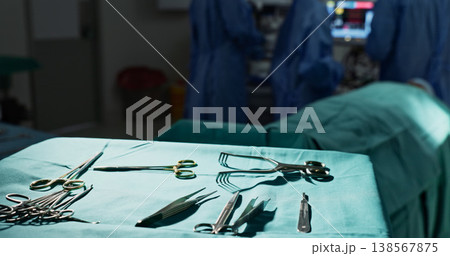 Surgery, health and tools in operation theatre, help in medicine with treatment and closeup of equipment on table. Metal, medical and surgical instrument with doctor people at hospital for healthcare 138567875