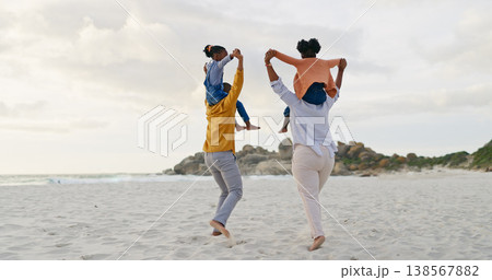 Kids on parents shoulders at beach and back view, travel and playful, freedom outdoor with love and bonding. Carefree, energy and holiday with people in nature, mom and dad with kids and family 138567882