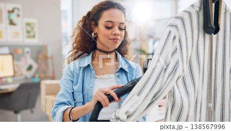 Ecommerce, fashion and woman steam clothes in workshop for order, delivery and distribution startup. Small business, online shopping and designer with heat for clothing for cargo, shipping or package 138567996