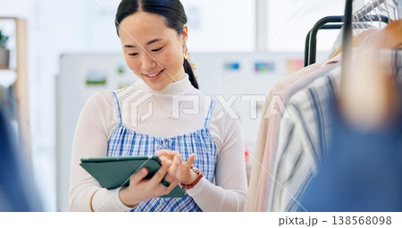 Fashion, small business and Asian woman with a tablet, store and retail with ecommerce, connection and search internet. Person, shop assistant and worker with technology, boutique and online shopping Fashion, small business and Asian woman with a tablet, store and retail with ecommerce, connection and search internet. Person, shop assistant and worker with technology, boutique and online shopping 138568098