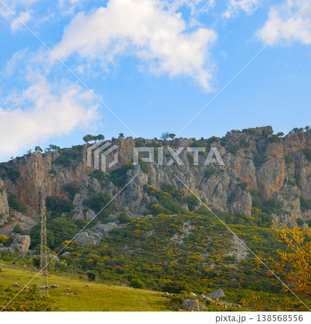 Majestic Taurus Mountains Scene with Power Lines and Blue Cloudy Sky 138568556