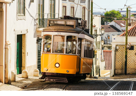 Yellow Tram in Alfama on Sunny Day. Lisbon, Portugal 138569147