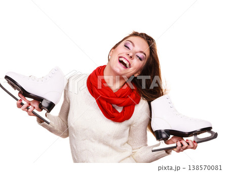 Smiling woman with ice skates 138570081