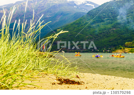 Fjord with people kayaking, Flam Norway 138570298