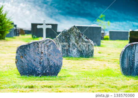 Churchyard in Nes village at fjord, Norway 138570300