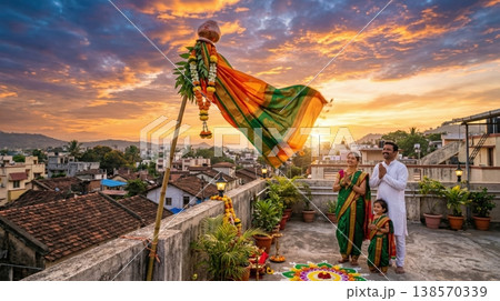 Family looking at Gudi on rooftop under warm morning sun. Concept of Gudi Padwa Indian festival and shared cultural celebration. 138570339