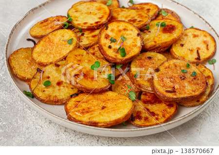 Crispy potato slices, with parmesan cheese and spices, fried in the oven, homemade, no people, Crispy potato slices, with parmesan cheese and spices, fried in the oven, homemade, no people, 138570667