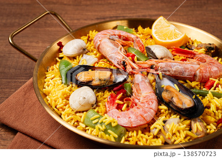 Seafood paella, in a frying pan, on a wooden table, no people, Seafood paella, in a frying pan, on a wooden table, no people, 138570723