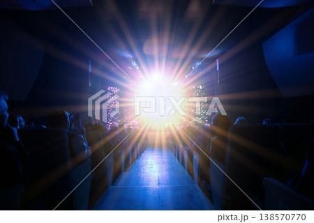 Bright light display captivates audience during evening performance in an indoor venue Bright light display captivates audience during evening performance in an indoor venue 138570770