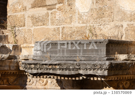 Part of the stone wall of the ancient amphitheater with architectural elements. Part of the stone wall of the ancient amphitheater with architectural elements. 138570869