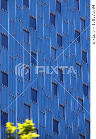 Windows on a blue skyscraper wall Windows on a blue skyscraper wall 138571694