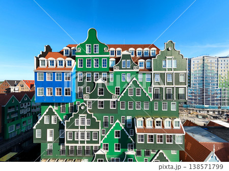 Colorful hotel in Zaandam, Netherlands. Aerial of Quirky Dutch Building Facade in Sunny Day. Colorful hotel in Zaandam, Netherlands. Aerial of Quirky Dutch Building Facade in Sunny Day. 138571799