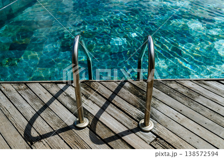 Tropical beach jetty in Mauritius resort with turquoise sea and sky. Tropical beach jetty in Mauritius resort with turquoise sea and sky. 138572594