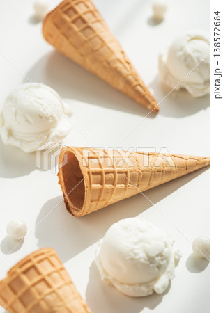 Vanilla Ice Cream Cones with Scoops on White Table 138572684