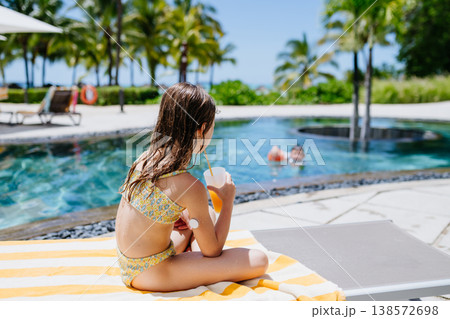 Diabetic girl during tropical beach vacation. Diabetic girl during tropical beach vacation. 138572698