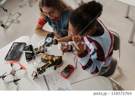 High school students working on robotics project. Girls in STEM. High school students working on robotics project. Girls in STEM. 138572764