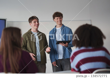 Teen student listening attentively during class with a digital tablet. 138572771