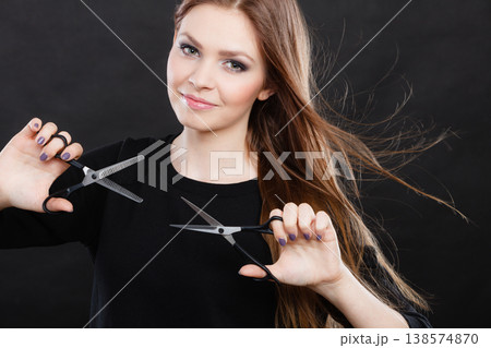 Professional hairdresser with scissors ready to cut. Professional hairdresser with scissors ready to cut. 138574870