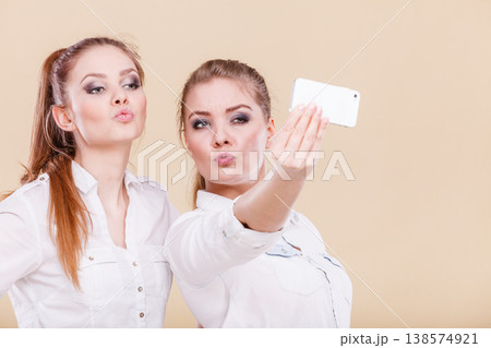 friends student girls taking self photo with smart phone 138574921