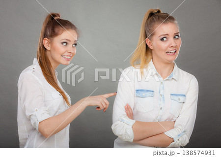 woman asking apologize to her offended friend after quarrel. woman asking apologize to her offended friend after quarrel. 138574931