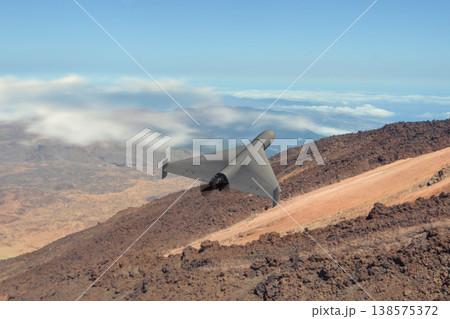 UAV performs reconnaissance in mountainous military conflict risk zone 138575372